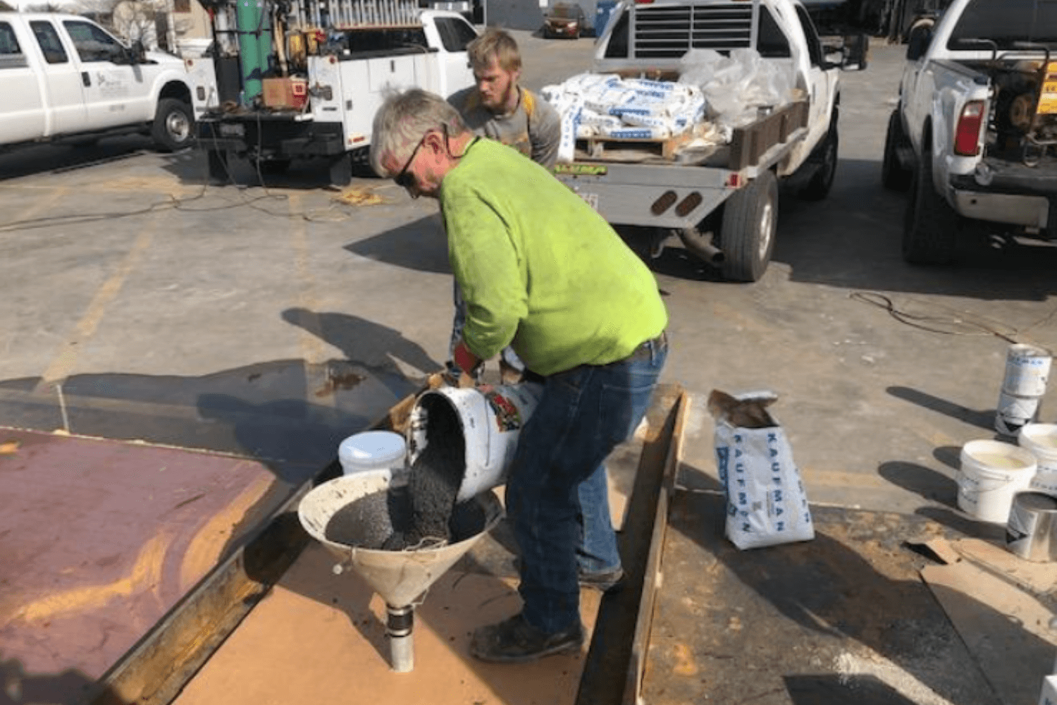 Mixed grout was poured into a large funnel attached to the access pipe nipples.