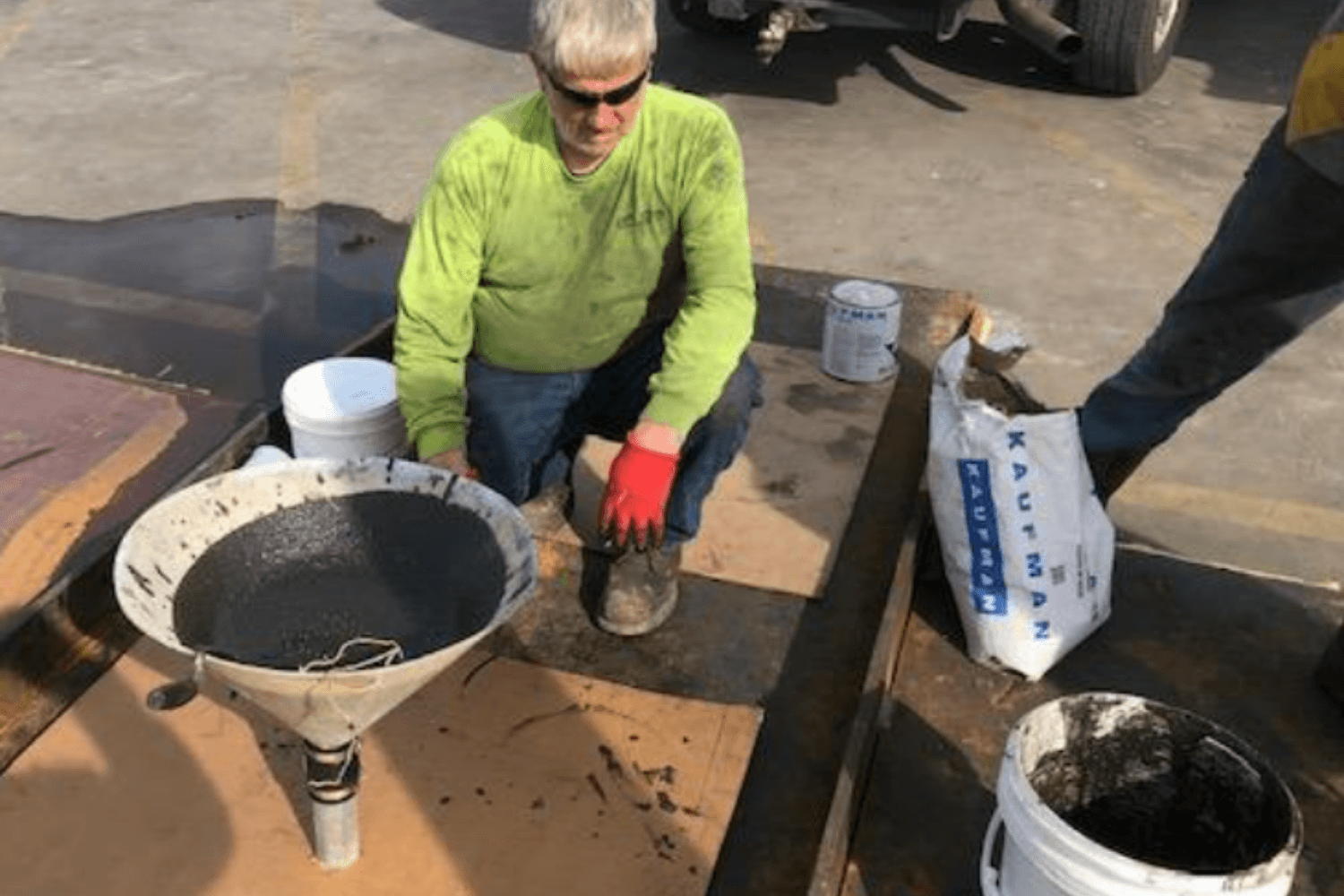 The contractor monitored the flow of grout until it was visually observed and filled up into the access pipe nipples. All ports were left with 6” of grout standing in them to assure complete filling of the voids beneath the ramp.